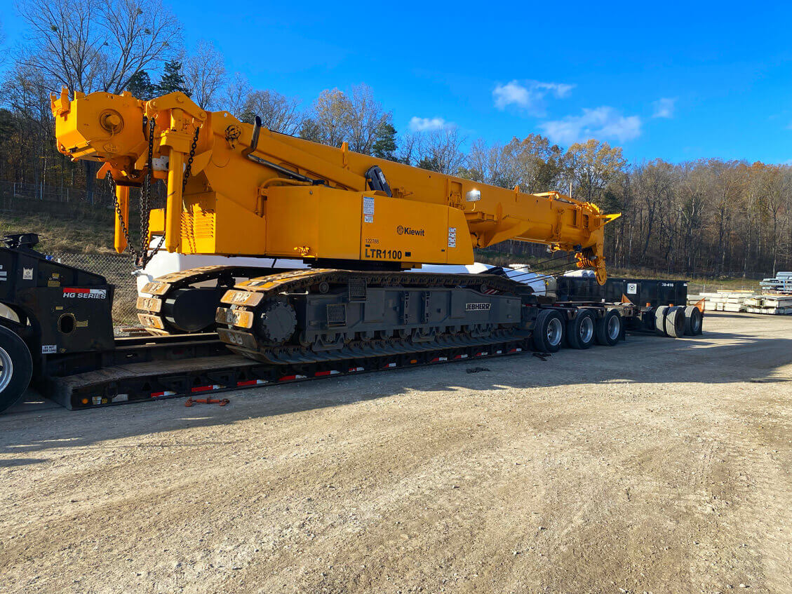 Telescopic Crawler Crane Being Hauled. Telescopic Crawler Crane LTR 1100