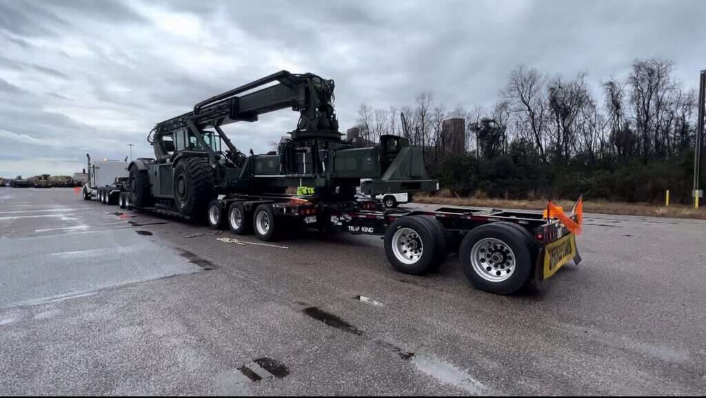 semi truck with green crane load